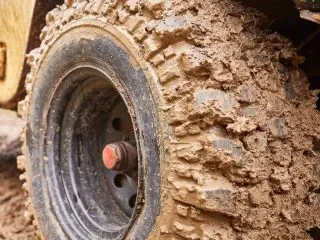 cropped-dirty-off-road-car-tire-in-mud-close-up-2021-12-23-17-44-01-utc-1-scaled-1.jpg
