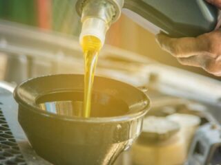 cropped-man-pouring-oil-into-car-royalty-free-image-1598901693.jpg