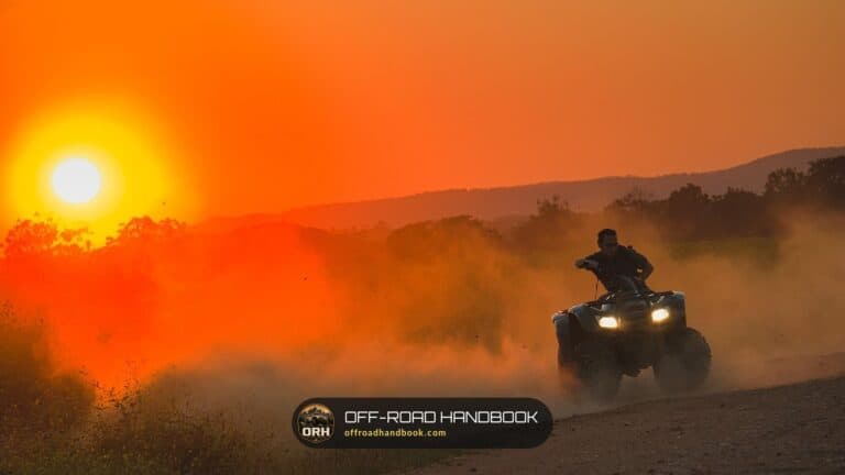ATV rider kicking up dust at sunset — Off-Road Handbook