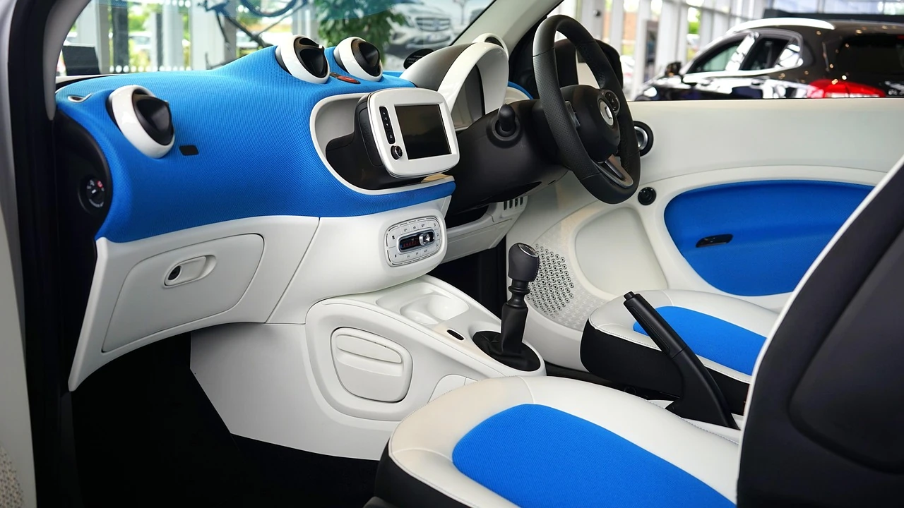 Blue and white car interior with a dash-mounted touchscreen display