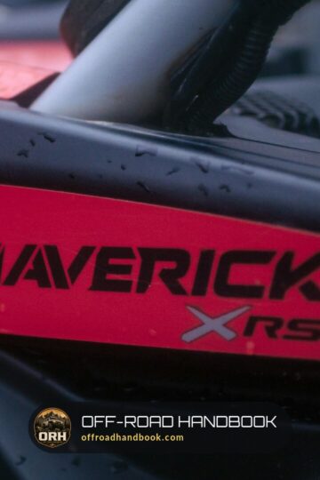 Close-up of the red MAVERICK XRS side panel on a black Can-Am Maverick X3