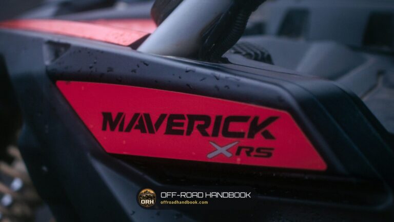 Close-up of the red MAVERICK XRS side panel on a black Can-Am Maverick X3