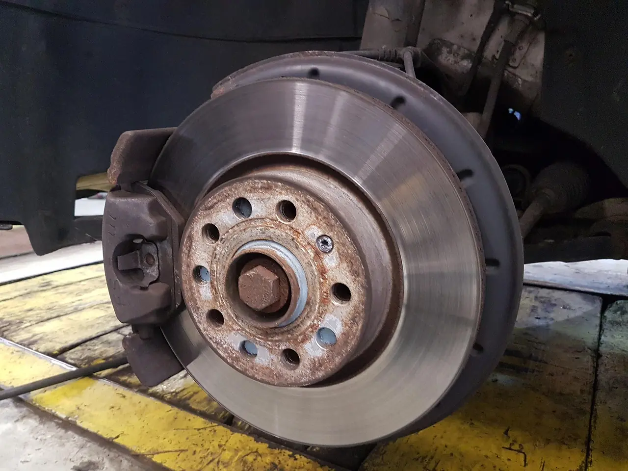 Front brake rotor, caliper and hub with the wheel removed