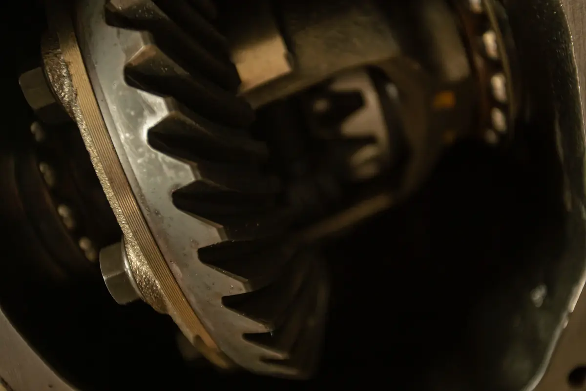 Close-up of ring gear teeth inside an open axle differential housing