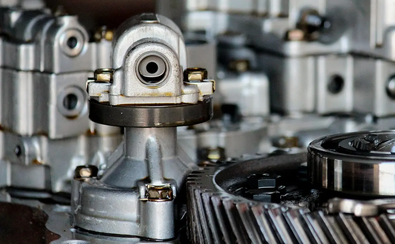 Close-up of a disassembled gearbox showing gears, shafts and bearings
