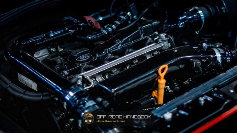 Close-up of an engine bay with the oil dipstick handle — Off-Road Handbook