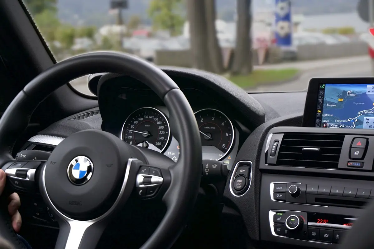 Car dashboard with a navigation display mounted in the center; the car is not a Jeep