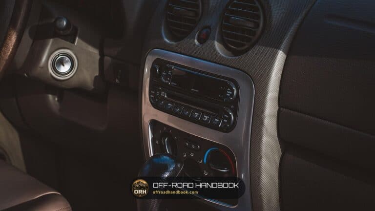 Jeep dashboard center console with the factory radio — Off-Road Handbook
