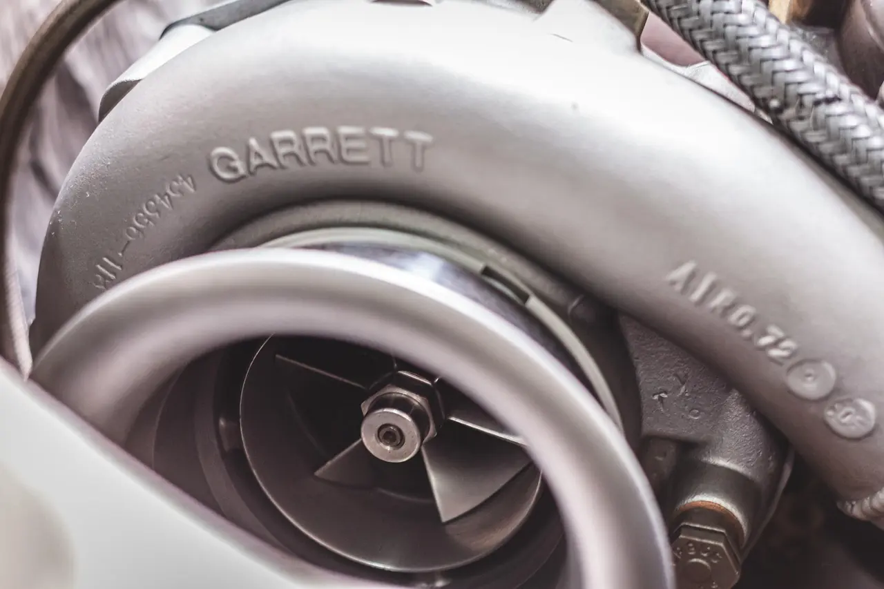 Garrett turbocharger removed from an engine showing the compressor housing and outlet