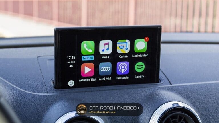 Smartphone projection screen showing app icons on a car dashboard, in an Audi rather than a Jeep