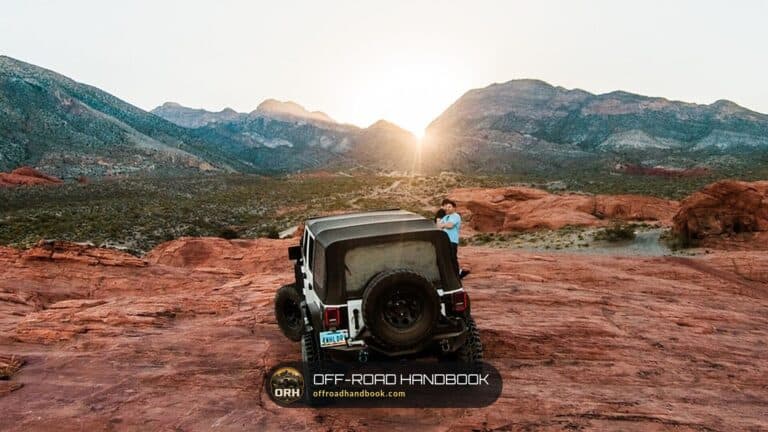 Jeep Wrangler parked on red rock at sunset — Off-Road Handbook