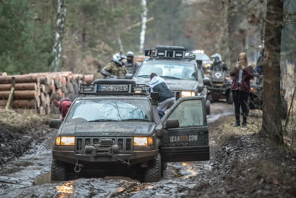 Off-road 4x4 driving through mud on a trail, the kind of load that heats transmission fluid