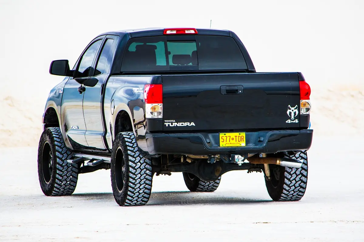 Lifted Toyota Tundra pickup on large off-road tires seen from the rear