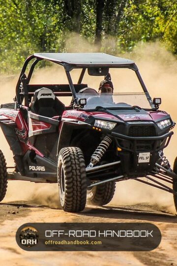 Polaris RZR XP 1000 side-by-side kicking up a cloud of dust on a dirt trail