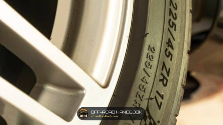 Close-up of a tire sidewall showing the molded size marking 225/45 ZR 17 — Off-Road Handbook