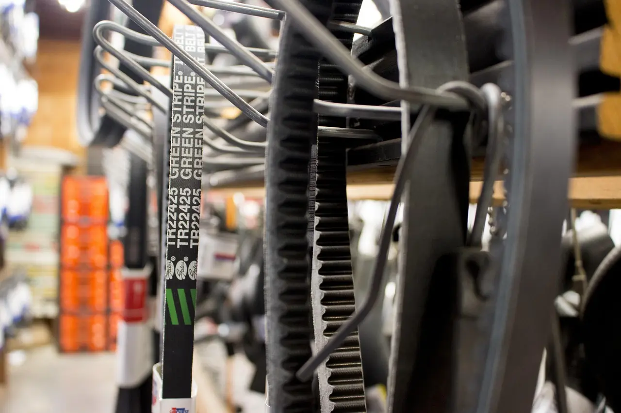 Rack of replacement drive belts in a parts store, stock photo of V-belts and not an 800SX part