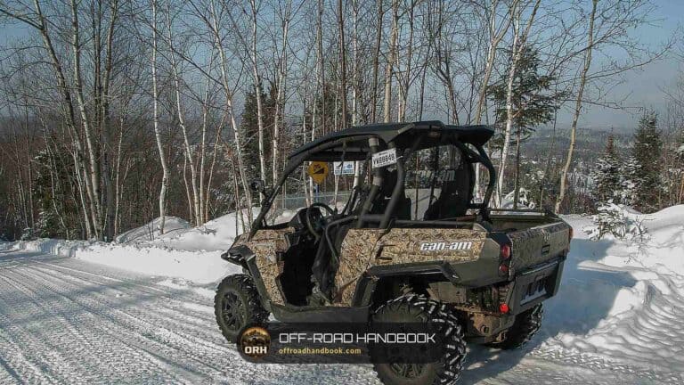 Camouflage utility side-by-side parked on a snowy trail — Off-Road Handbook