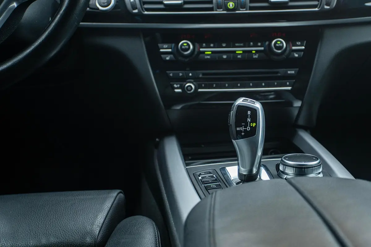 Center console of a modern passenger car with an automatic gear selector (not a Jeep)